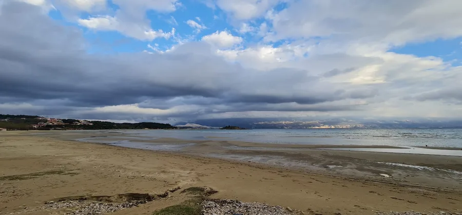 Paradise beach with dramatic clouds